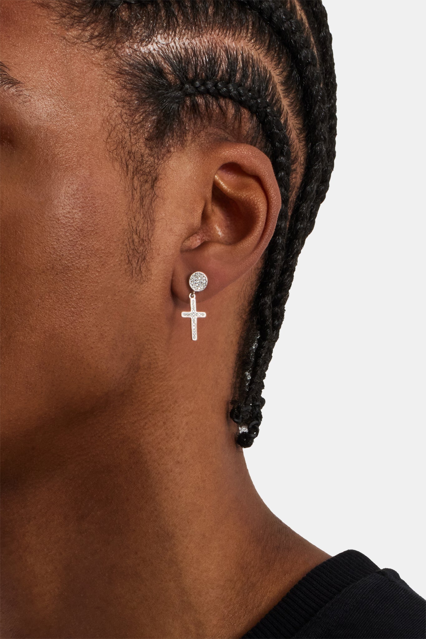 male model wearing the iced cross drop stud earrings